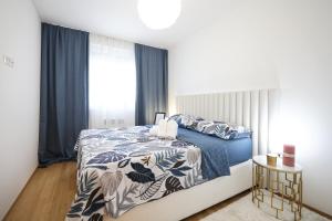 Posteľ alebo postele v izbe v ubytovaní Apartment AnViNi