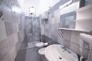 a bathroom with a sink and a toilet and a shower at Residenza Luce Sul Mare in Tropea +58 photos