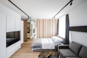Ένα ή περισσότερα κρεβάτια σε δωμάτιο στο Masuria Apartments