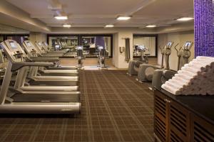 a gym with a row of treadmills and machines at Hyatt Centric Fisherman's Wharf San Francisco in San Francisco