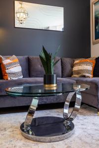 a coffee table in a living room with a couch at Bright cheery 4 bd apartment by Brighton Station in Brighton & Hove