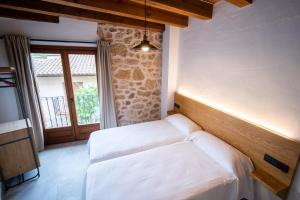 Postel nebo postele na pokoji v ubytování Casa Ronda