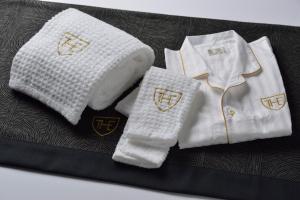 a pair of white socks and a white shirt and tie at The Royal Park Hotel Tokyo Haneda Airport Terminal 3 in Tokyo