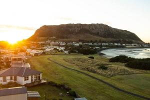 an aerial view of a town with a mountain at Stanley Beach House with Stunning Nut Views! in Stanley