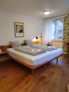 Säng eller sängar i ett rum på Bastis City Center Lucerne