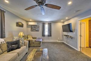 a living room with a couch and a ceiling fan at Cozy Getaway - 10 Miles to Mount Wachusett Skiing! in Leominster