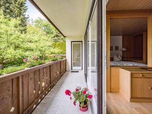 a balcony of a house with flowers on it at Gästehaus Christa Mauerer in Bad Reichenhall