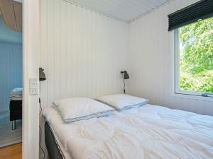 Postel nebo postele na pokoji v ubytování Holiday home Skjern XV