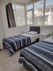 Кровать или кровати в номере Kardelen Otel