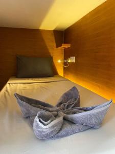 Postel nebo postele na pokoji v ubytování Kaniu Capsule Hostel