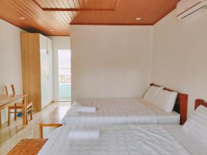 Postel nebo postele na pokoji v ubytování Hoang Sa Beach Healing Home + 66 fotografií
