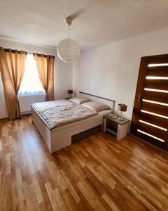 Postel nebo postele na pokoji v ubytování HARMONY Apartments