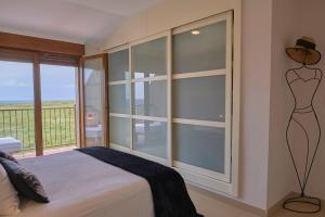 Postel nebo postele na pokoji v ubytování Agra de Corrubedo by Serendipia Turismo