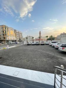 a parking lot with several cars parked in it at فندق اريف in Abha