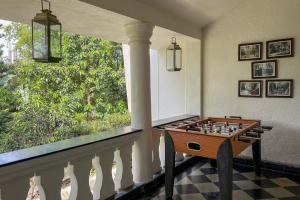 a room with a chess board on a table at La Bougainvillea with BBQ Grill at Porvorim by StayVista in Sinquerim