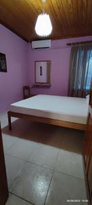 A bed or beds in a room at Aphrodite's House