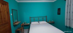 A bed or beds in a room at Aphrodite's House