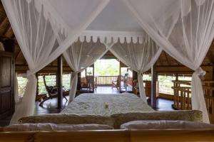 Postel nebo postele na pokoji v ubytování Bali Firefly BnB