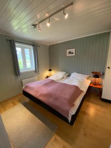 Un pat sau paturi într-o cameră la Wilderness House