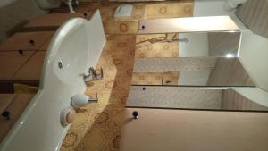 a bathroom with a toilet and a sink at Casa la Collina delle Ginestre in Eberbach