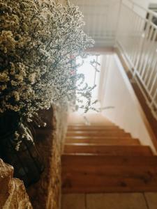 a stairway with flowers in a vase at B&B MARNUDD in Bisceglie