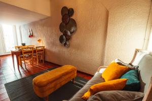 a living room with a couch and a table at Finisterre Casa di mare - Housea in Polignano a Mare