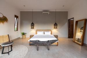 Ein Bett oder Betten in einem Zimmer der Unterkunft Villa Casa Orana