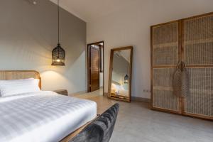 Ein Bett oder Betten in einem Zimmer der Unterkunft Villa Casa Orana