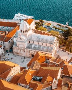 an aerial view of a large building with orange roofs at Lora in Skradin
