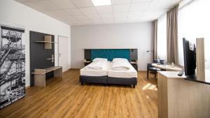 Postel nebo postele na pokoji v ubytování Hotel Fohnsdorf
