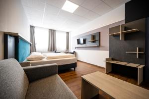 Postel nebo postele na pokoji v ubytování Hotel Fohnsdorf