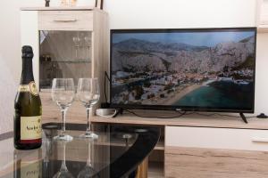 Televízia a/alebo spoločenská miestnosť v ubytovaní Apartment BUBA