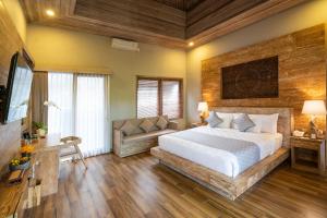 Postel nebo postele na pokoji v ubytování Arkamara Dijiwa Ubud