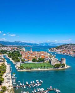 an aerial view of a harbor with boats at Apartments Angelus in Trogir