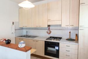 Kuchyň nebo kuchyňský kout v ubytování M310 - Marcelli, trilocale con terrazzo comodo ai servizi + 13 fotografií