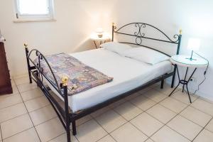 Postel nebo postele na pokoji v ubytování M310 - Marcelli, trilocale con terrazzo comodo ai servizi