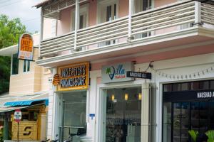 a store with signs on the side of a building at Villa Montecarlo in Puducherry