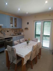 a kitchen with a table and chairs in a kitchen at Lux Trogir in Trogir