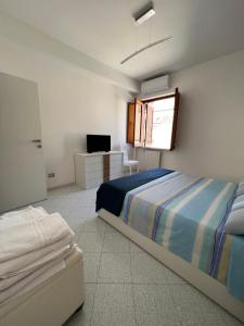 Postel nebo postele na pokoji v ubytování 4 Passi dal mare