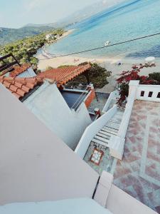 an aerial view of a house and the beach at Nereides Seaside Apartments in Marathokampos