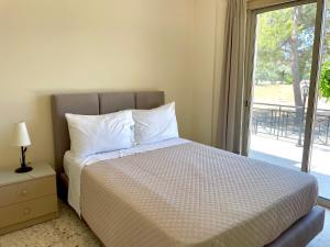 Кровать или кровати в номере Himonas Apartments
