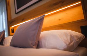 Postel nebo postele na pokoji v ubytování Hotel Tannenhof
