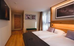 Postel nebo postele na pokoji v ubytování Hotel Tannenhof