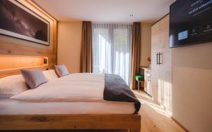 Postel nebo postele na pokoji v ubytování Hotel Tannenhof
