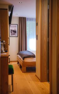 Postel nebo postele na pokoji v ubytování Hotel Tannenhof