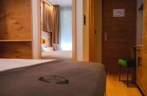 Postel nebo postele na pokoji v ubytování Hotel Tannenhof