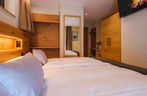 Postel nebo postele na pokoji v ubytování Hotel Tannenhof