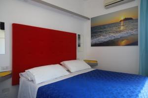 Postel nebo postele na pokoji v ubytování Hotel Cristina