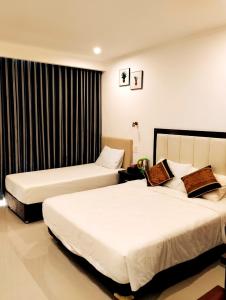 Giường trong phòng chung tại Ninh Chu Hotel
