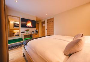 Postel nebo postele na pokoji v ubytování Hotel Tannenhof
